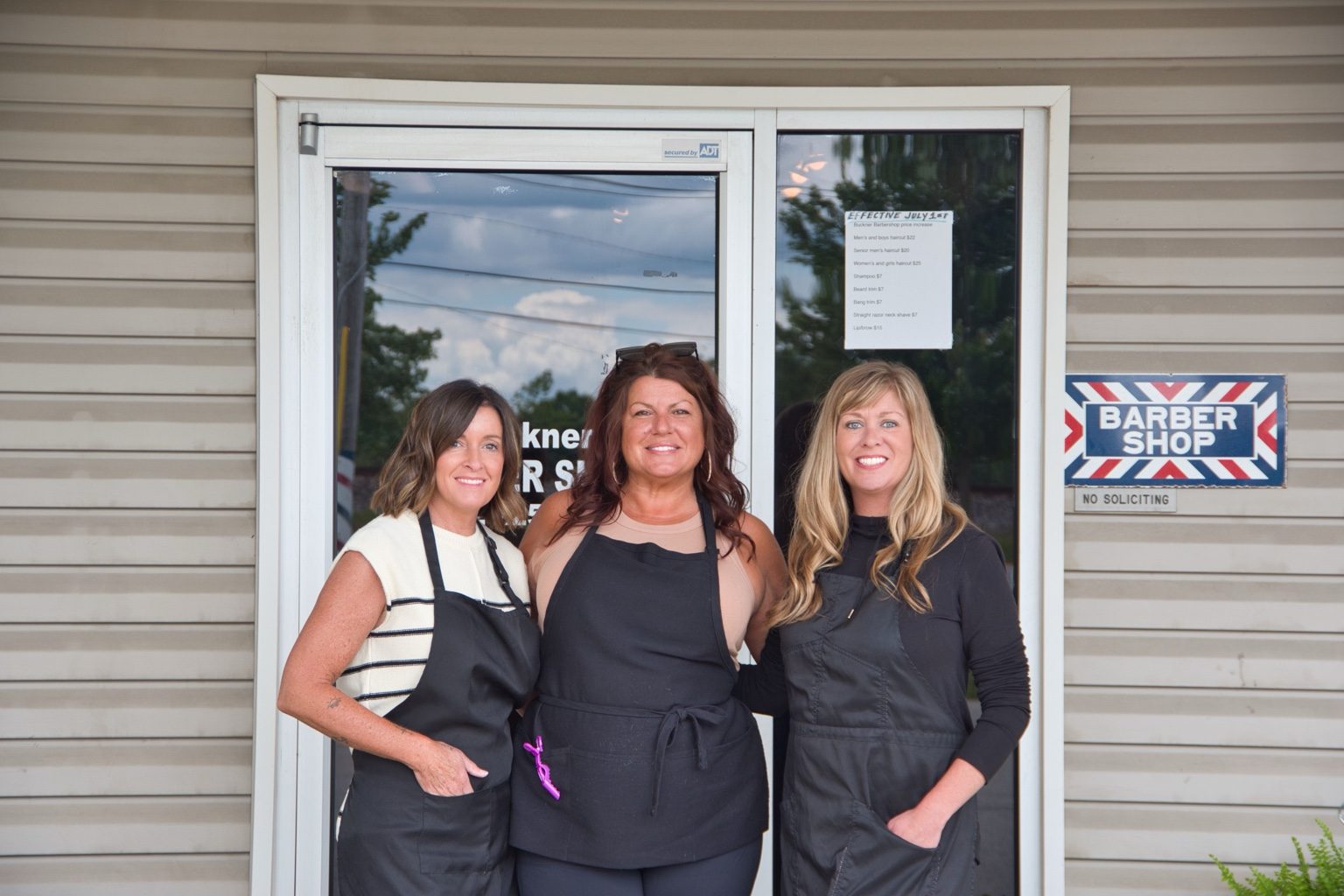 Buckner Barber Shop barber team outside the shop